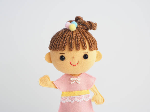 istock Illustration style child felt doll 1225578334