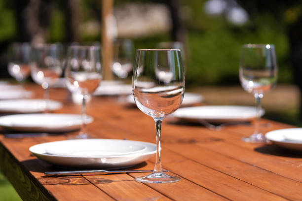 istock Served wooden table without a tablecloth. Cafe in the open air park 1225578458