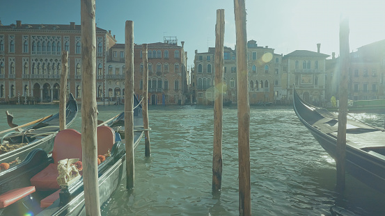 View of San Giorgio Maggiore Island with gondolas from San Marco square in Venice at sunrise, Italy, Europe.