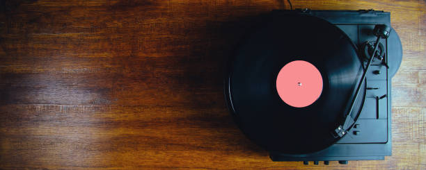 istock Turntable and vinyl records on a dark background 1225580839