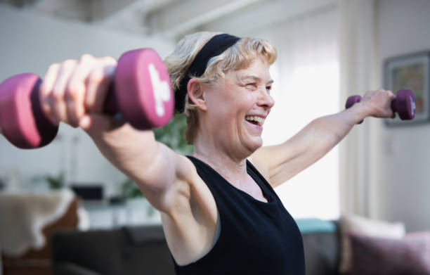 istock Mature woman exercising inside the house 1225585206