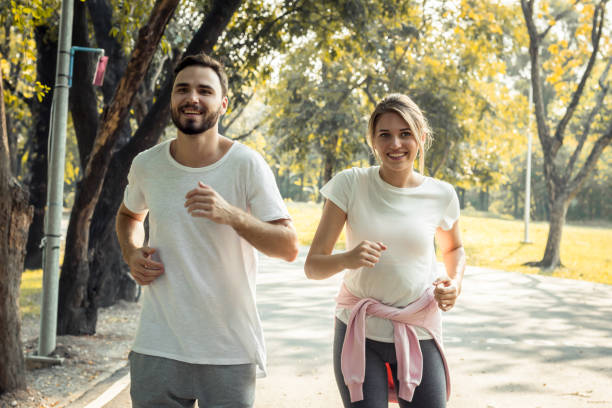istock Couples exercise at the park in the morning. 1225587124