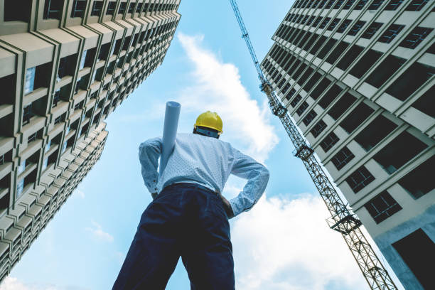 istock Engineer looking up the building he designed proudly 1225587630