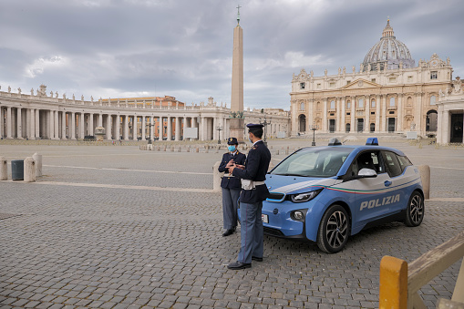 Vatican, Italy, May 18 -- An Italian police patrol checks the square of the basilica of St. Peter's, still empty despite the end of the restrictions imposed by the lockdown for the Covid-19 crisis.