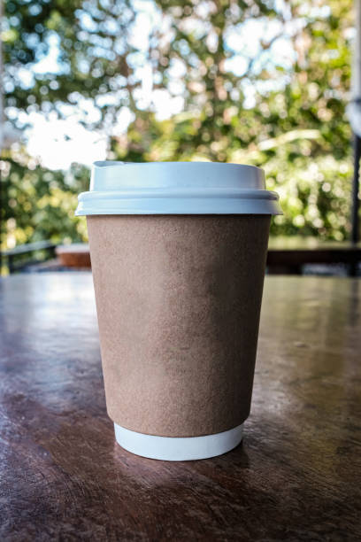 istock A hot coffee cup on wooden table 1225589843