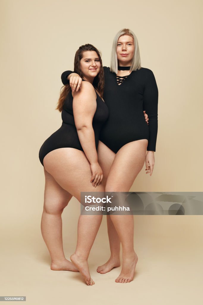Plus Size Models Fullfigured Women Fulllength Portrait Brunette And Blonde  In Black Bodysuits Posing On Beige Background Body Positive Concept Stock  Photo - Download Image Now - iStock