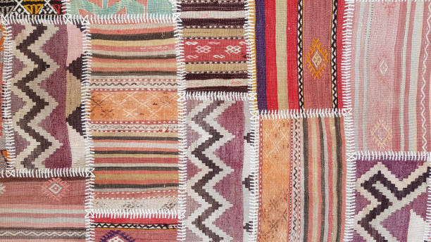 Patch texture of traditional Turkish ethnic patterned carpet closeup stock photo