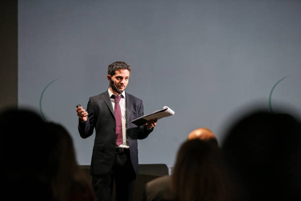 istock Public speaker giving talk at Business Event 1225591863