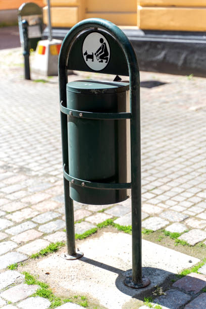 istock Dog waste bin. Pet waste station in city. 1225593237