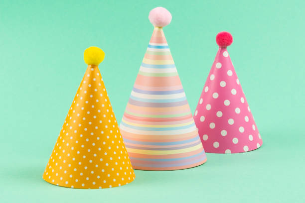 istock Colorful birthday caps on mint background. 1225594490
