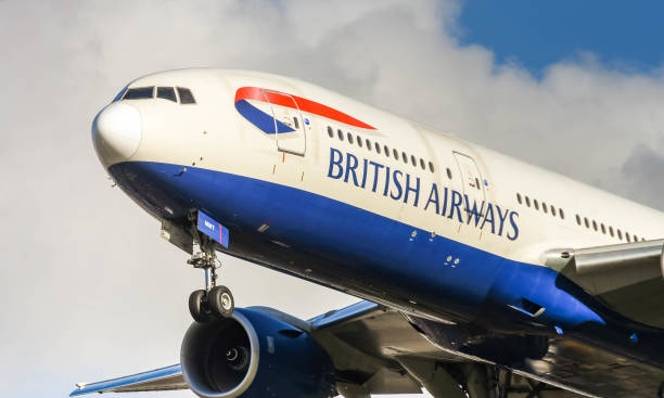 British Airways Boeing 777 long haul airliner landing at London Heathrow Airport. London, England - November 2018: British Airways is owned by Spanish company International Airlines Group aircraft undercarriage on a boeing 777 stock pictures, royalty-free photos & images