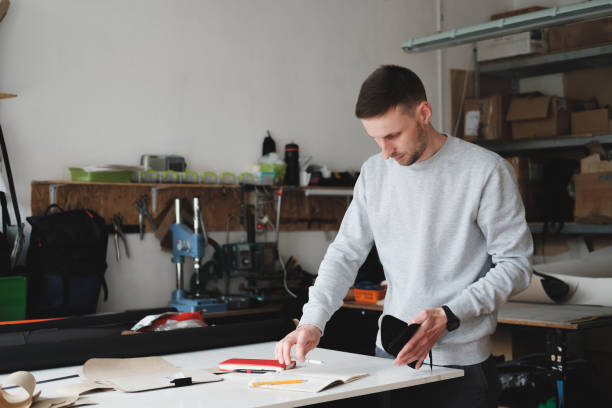 istock Portrait of a clothing designer or engineer at a generic workshop. 1225598231