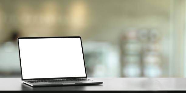 istock Computer laptop putting on working desk over comfortable living room as background. 1225598290