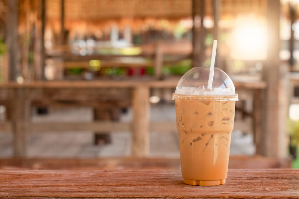 istock Iced Espresso Coffee Placed on a Wooden Board in a Vintage Old Coffee Shop 1225599708