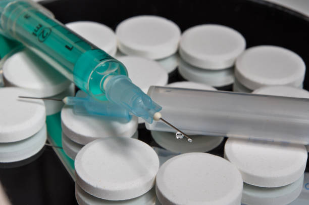 Vaccine and pills on background. Medical and healthcare themes