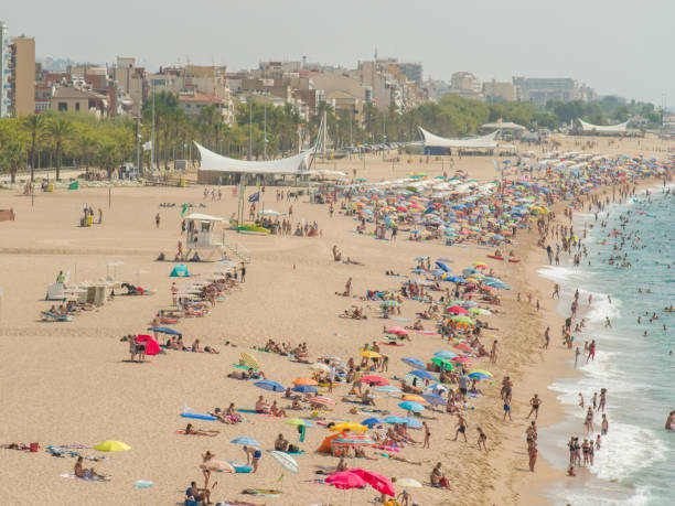 istock People at beach in Calella city. Spain 1225601040