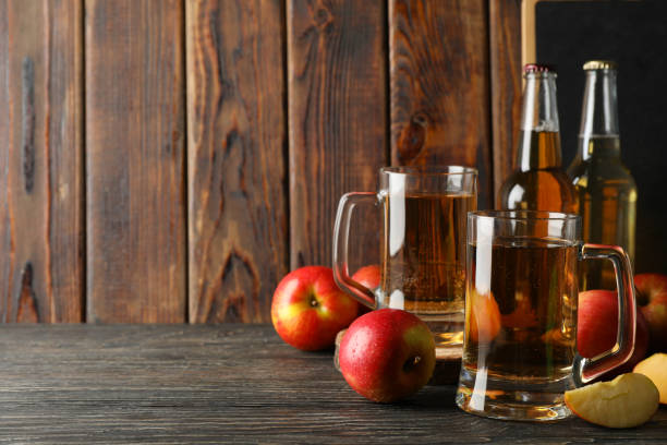 istock Composition with cider and apples on wooden background 1225601671