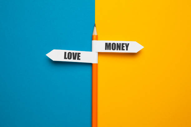 istock Pencil - direction indicator - choice of love or money 1225601953