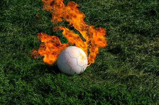 Soccer League fever very high under Coronavirus shadow all the world - Soccer Ball is burning with rank and overgrown grass