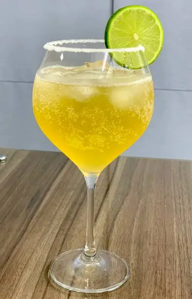 Drink with beer, salt, ice and lemon