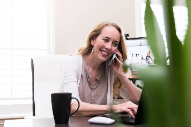 istock Smiling businesswoman working from home 1225603730