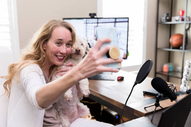 istock Beautiful woman taking selfie with dog 1225603760