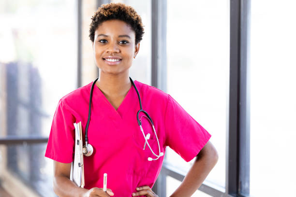 istock Attractive, confident doctor smiles for camera 1225603826