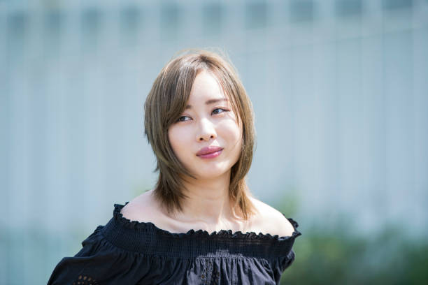 istock Asian young woman at sunny day 1225606267