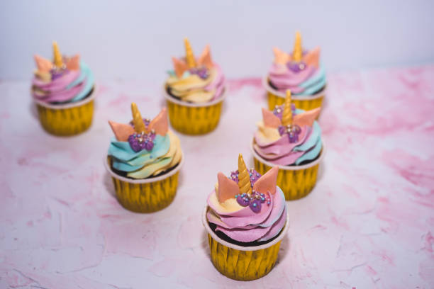 istock Rainbow unicorn cupcake in a yellow cup. A feast for a little princess. 1225606290