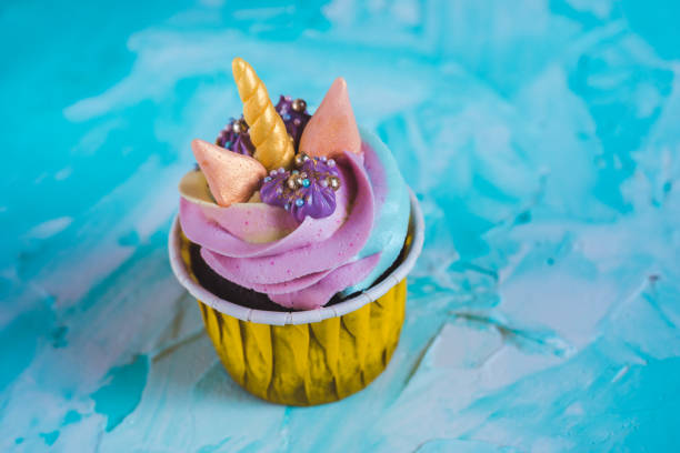istock Rainbow unicorn cupcake in a yellow cup. A feast for a little princess. 1225606294