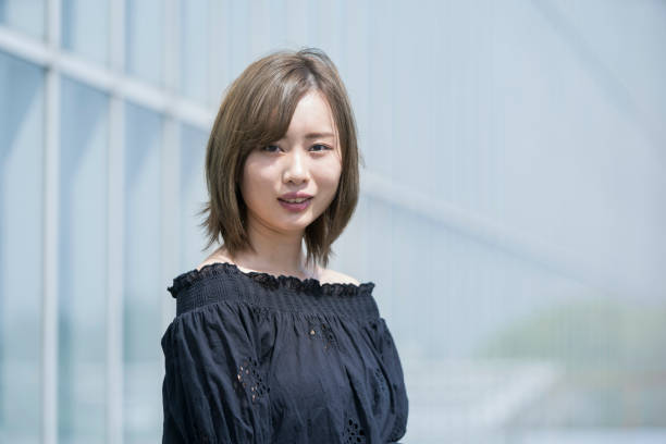 istock Asian young woman at sunny day 1225607654