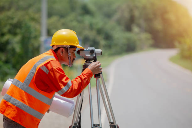 istock Surveyor marking road construction and land 1225607812