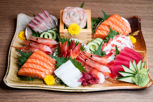 Luxury sashimi set with hokkigai, surf clam, prawn, tuna, octopus, salmon, wasabi, hamachi, maguro, tako, amebi.
