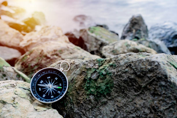 istock compass on the bank with sunflare 1225609266