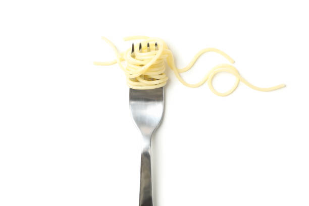 istock Fork with tasty pasta isolated on white background 1225610235