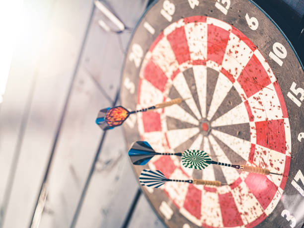 istock Dartboard and darts outside 1225610273
