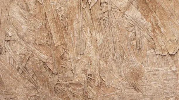 Vector illustration of Raw flat OSB board in macro - wooden textured  board in vector with visible sharp flattened wooden components - beautiful natural multilayered messy background