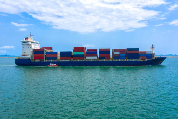 istock Container , container ship in export and import business and logistics. Shipping cargo to harbor by crane. Water transport International. Aerial view and top view. 1225612119