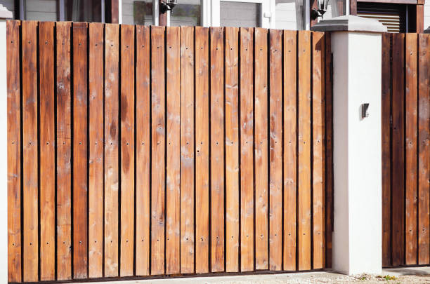 istock Modern wooden fence with concrete pillars. 1225613043