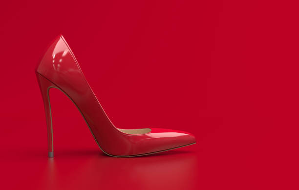 istock Single red womens high-heeled shoe with a pointed toe stand on the plain red background. Red pumps shoe in a classic style. Monochrome illustration. 3D rendering. 1225613917