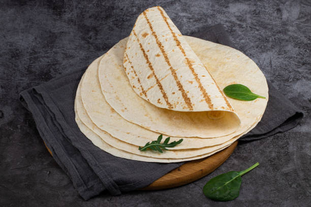 istock Stack of corn tortillas on dark background. Mexican food 1225613949