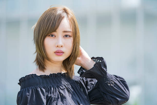 istock Asian young woman at sunny day 1225614201