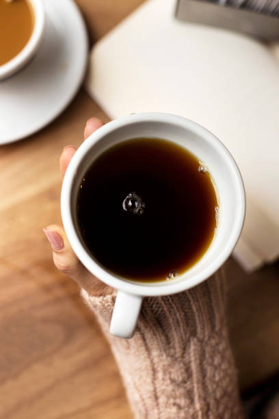istock Coffee Cup, Lady's hands holding Coffee Cup, Woman holding a white mug 1225614346