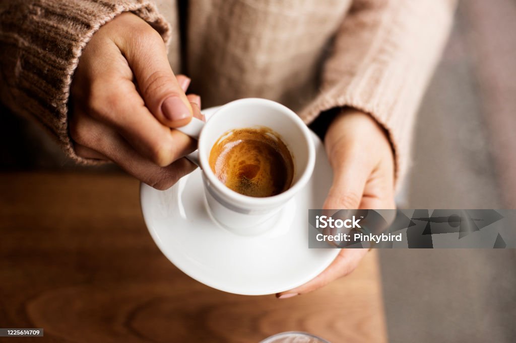 Coffee Cup, Lady's hands holding Coffee Cup, Woman holding a white mug, Espresso in white cup Coffee - Drink, Cup, Mug, Cafe, Directly Above, Frothy Drink, hand, Women, One Woman Only,  Holding, Coffee Cup, Latte, Cappuccino, espresso, tea, Coffee - Drink Stock Photo