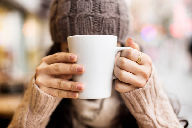 istock Coffee Cup, Lady's hands holding Coffee Cup, Woman holding a white mug 1225615202