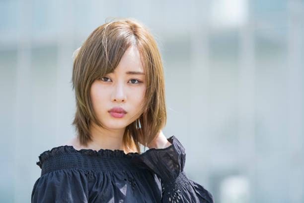 istock Asian young woman at sunny day 1225618573