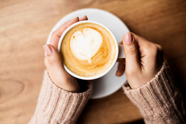 istock Coffee Cup, Lady's hands holding Coffee Cup, Woman holding a white mug 1225619338