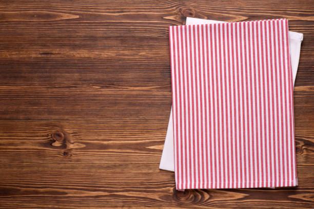 istock Kitchen towels on brown rustic wooden table top 1225619536