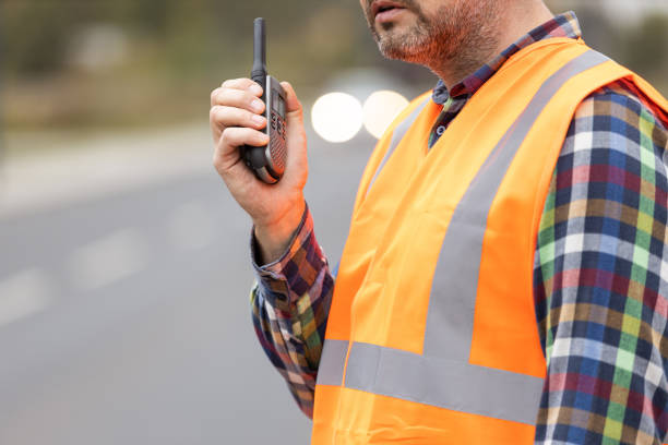 istock Road construction workers talking to walkie-talkie 1225619966