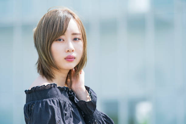 istock Asian young woman at sunny day 1225621182